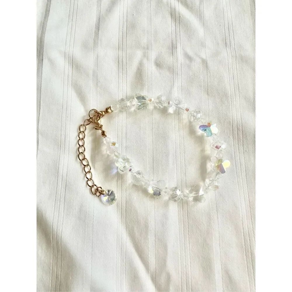 Iridescent beaded butterfly and flower bracelet ￼